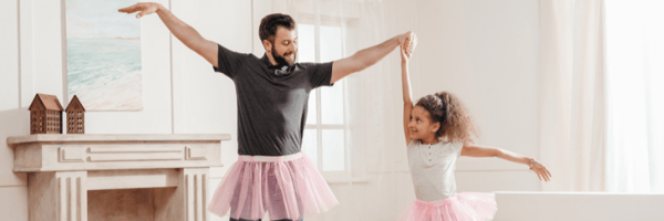 Father and daughter doing ballerina