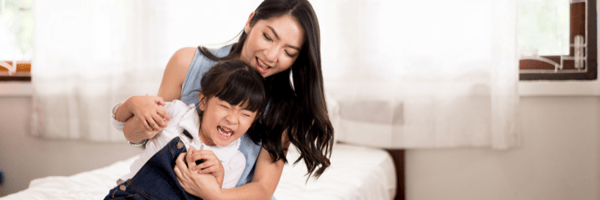 Mom and daughter laughing