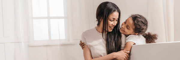 Mother and daughter smiling