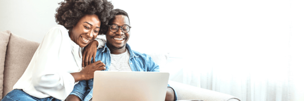 Couple buying sports tickets online