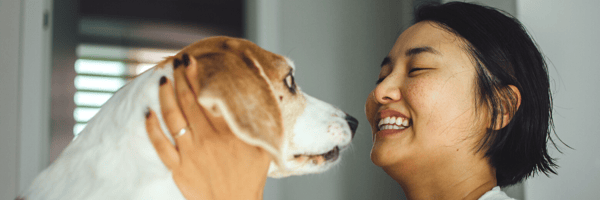Woman playing with her dog