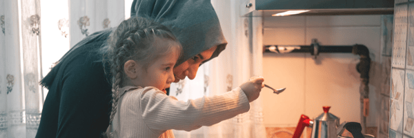 Mother and daughter cooking