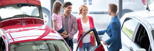 Family at car dealership 