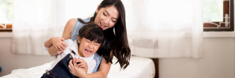 Mom and daughter laughing