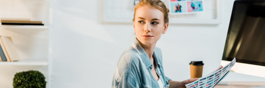 Woman working on photos looking away