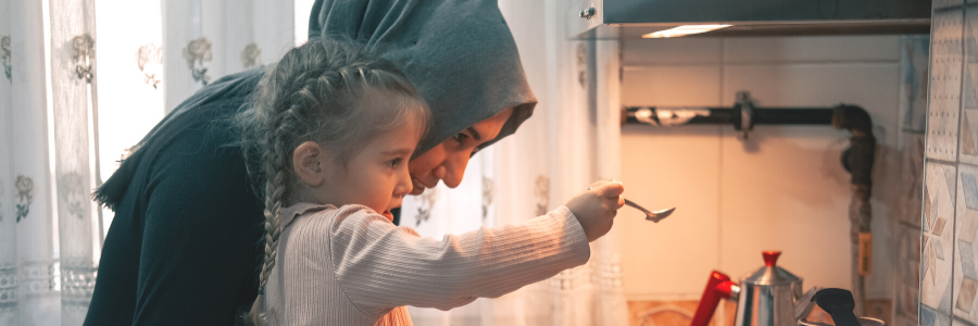 Mother and daughter cooking