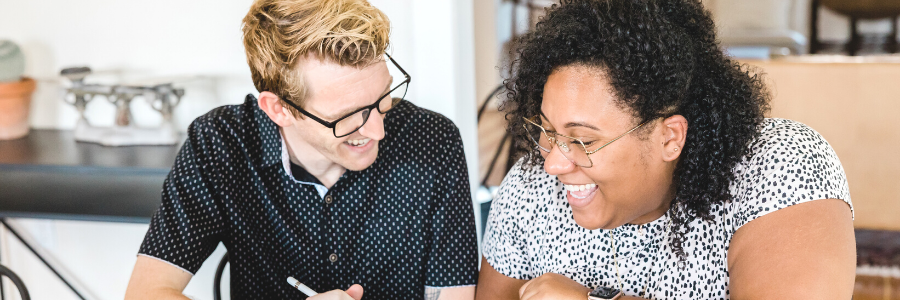 Couple discussing money and smiling