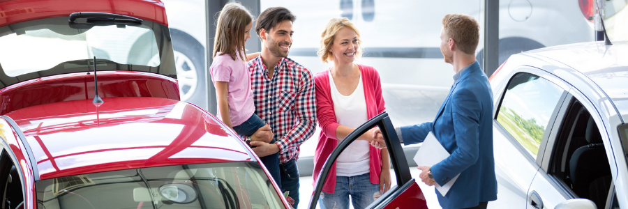 Family at car dealership 