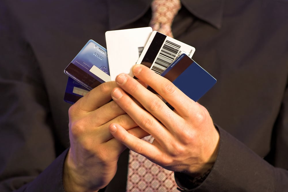 business man holding credit cards