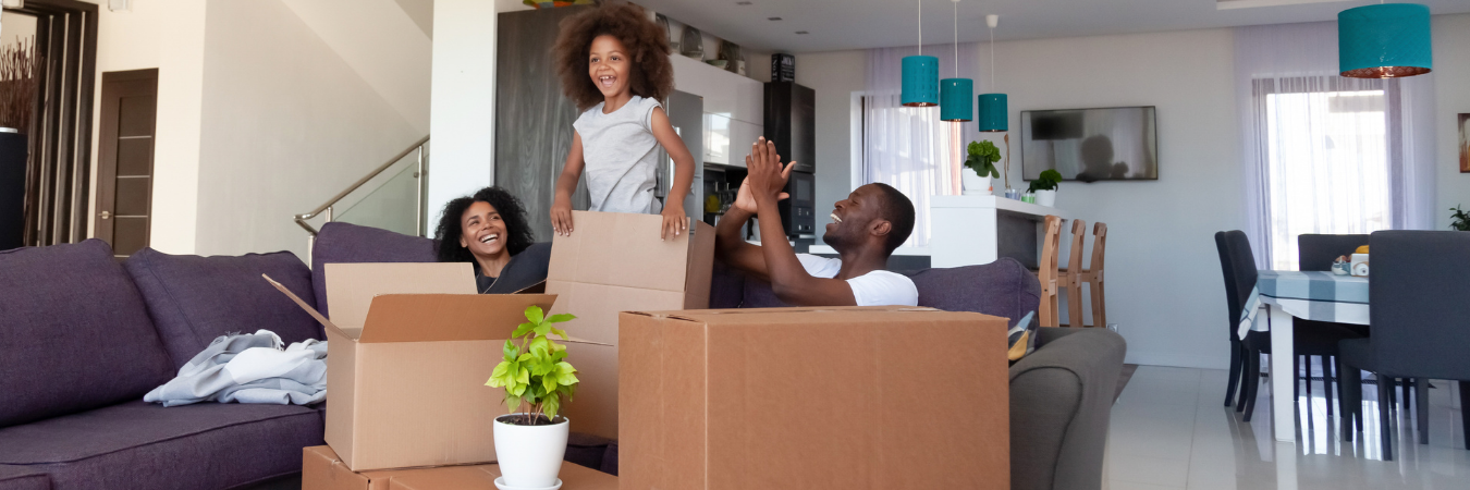Happy family unpacking to move into new home!